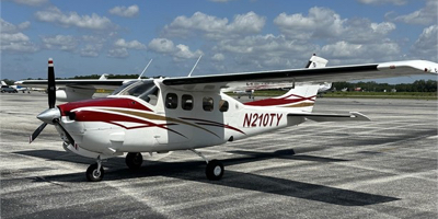 Cessna 210 Press.