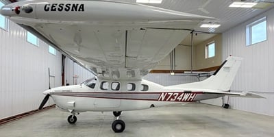 Cessna 210 Press.